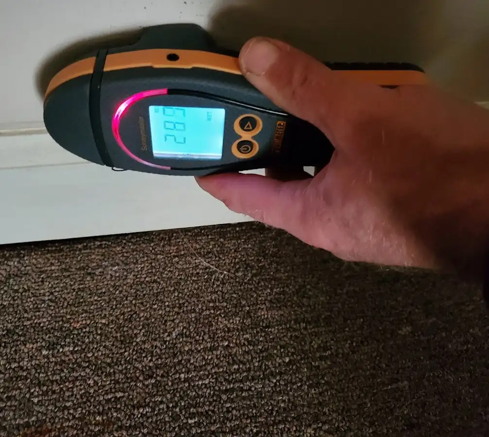 Moisture detection at baseboard during Storm Damage Restoration in Killingworth